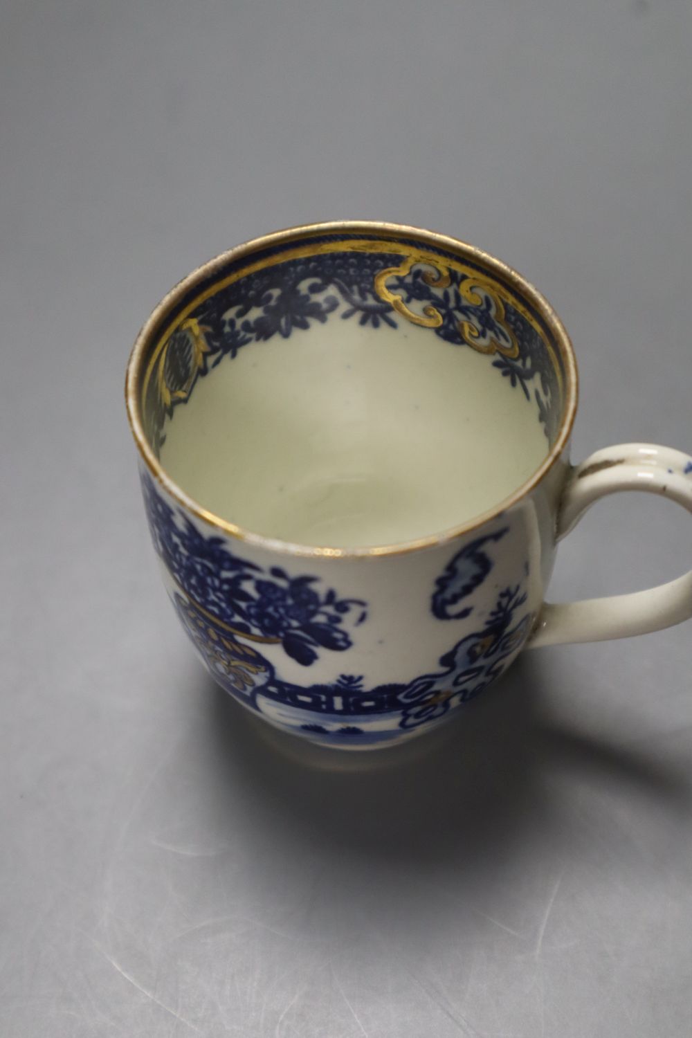 A Worcester Bat pattern coffee cup and saucer and a European Landscape teabowl and saucer